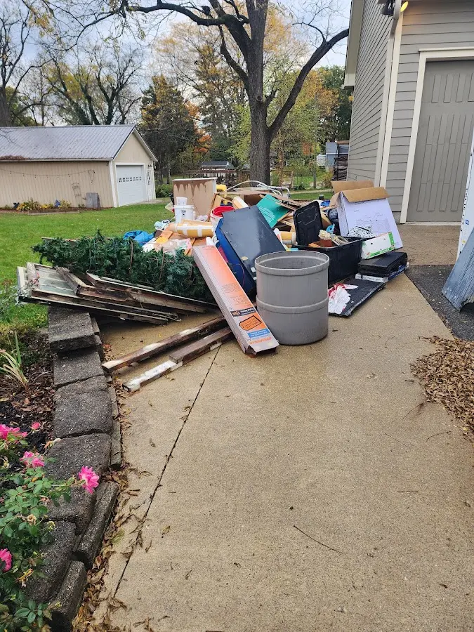 Dumpster being loaded with debris for Roofing Dumpster Rental in Cherokee